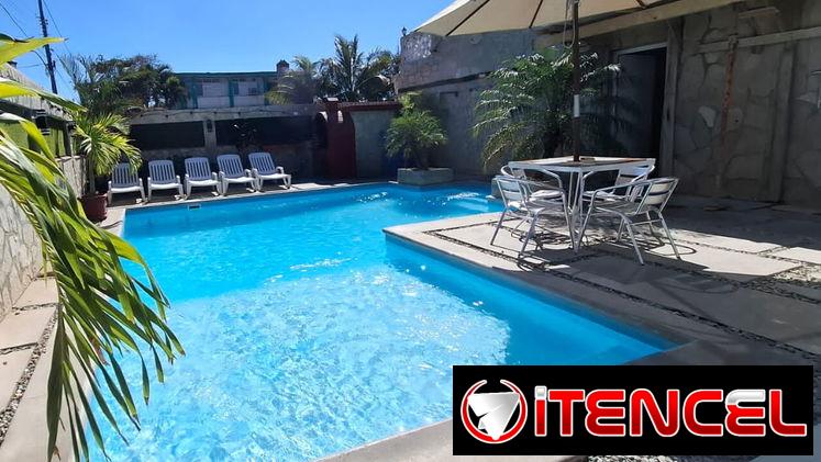 Casa Janet con piscina y 5 habitaciones para 18 personas. Paneles solares..whatssap 5 2959440