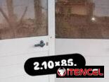 Ventanas de hierro con sus cristales en 70 mil.,puerta de marquetería de aluminio y cristalería en 70 mil.,
