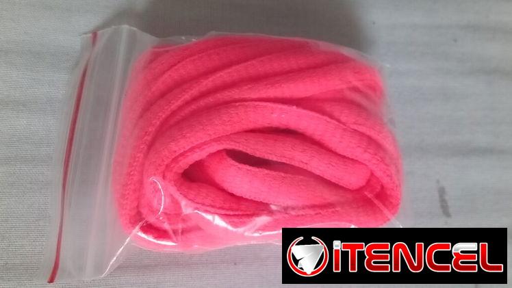 Par de cordones de zapatos color naranja fosforescente. Nuevos