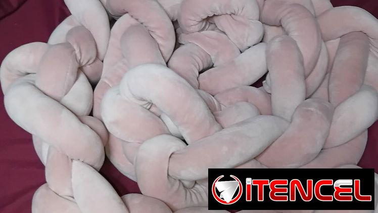 Protector de cuna trenzado rosado