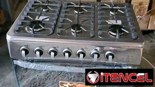 Cocina de Gas con horno 6 quemadores Marca Rudenkov Tapa de Cristal Templado, Frente espejo, Magneto  precio $320 USD