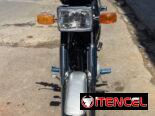 Cambio mi ax 100 por moto semi automática como la de la primera foto