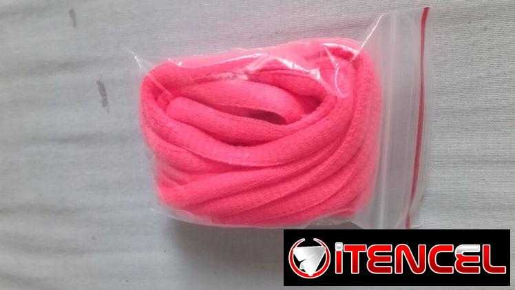 Par de cordones de zapatos color naranja fosforescente. Nuevos