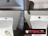 Lavamanos con muebles y tazas