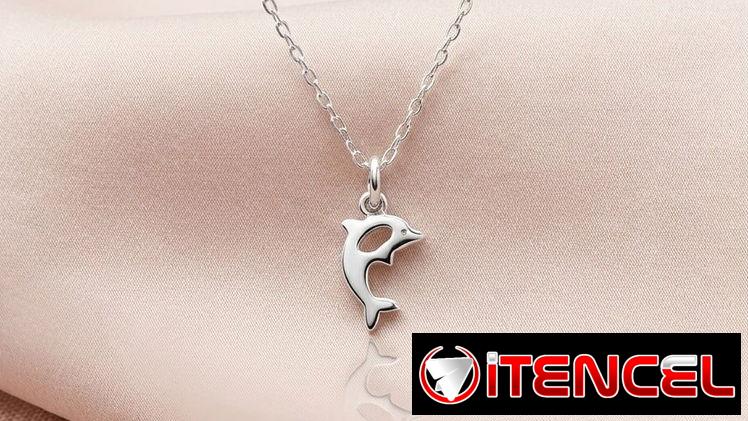 Juego de aretes cadenas y dijes
