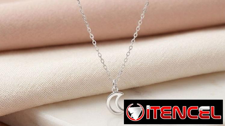 Juego de aretes cadenas y dijes