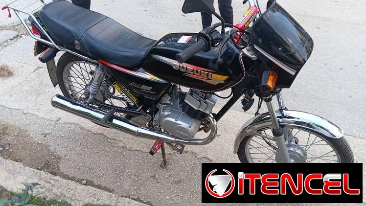 Suzuki AX-100 — foto 2