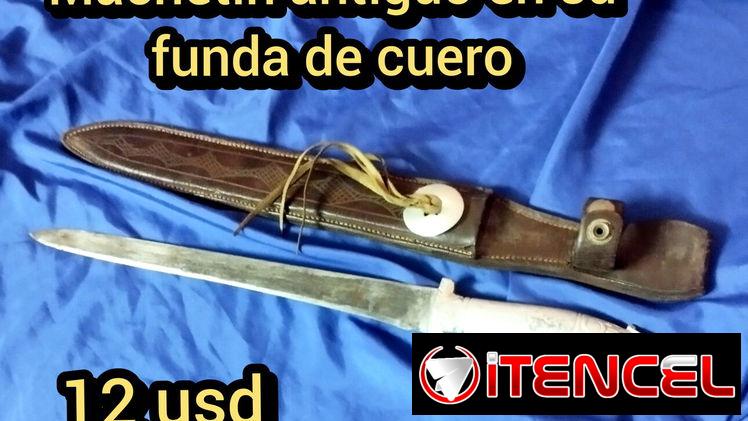 Machetin antiguo en su funda de cuero