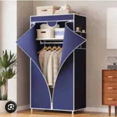 💜Escaparate desarmable, con su lona que lo recubre para proteger la ropa del polvo.Precio 40 usd